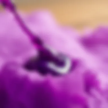 Dyeing Techniques for Fabric with Purple A close-up of a purple dye being applied to fabric or paper