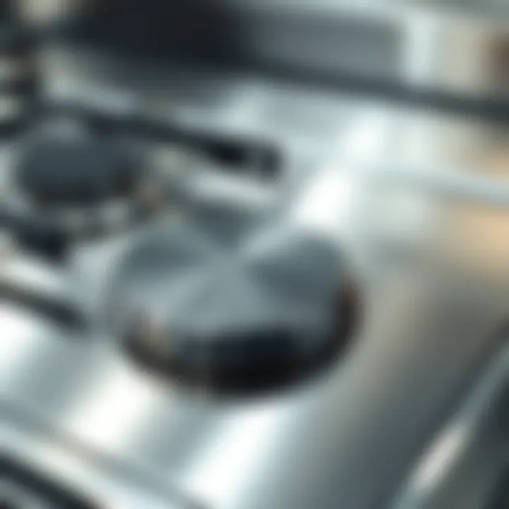 Sparkling clean inox stove surface reflecting light