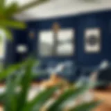 A stylish living room featuring navy blue walls and elegant decor